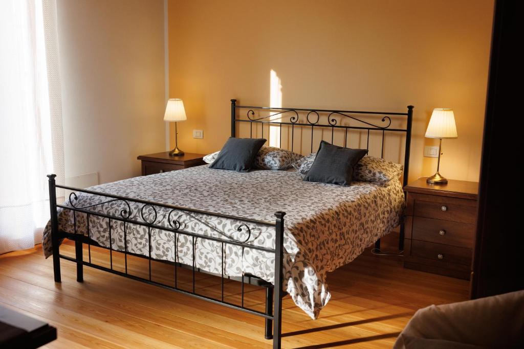 Postel nebo postele na pokoji v ubytování Manfredi B&B