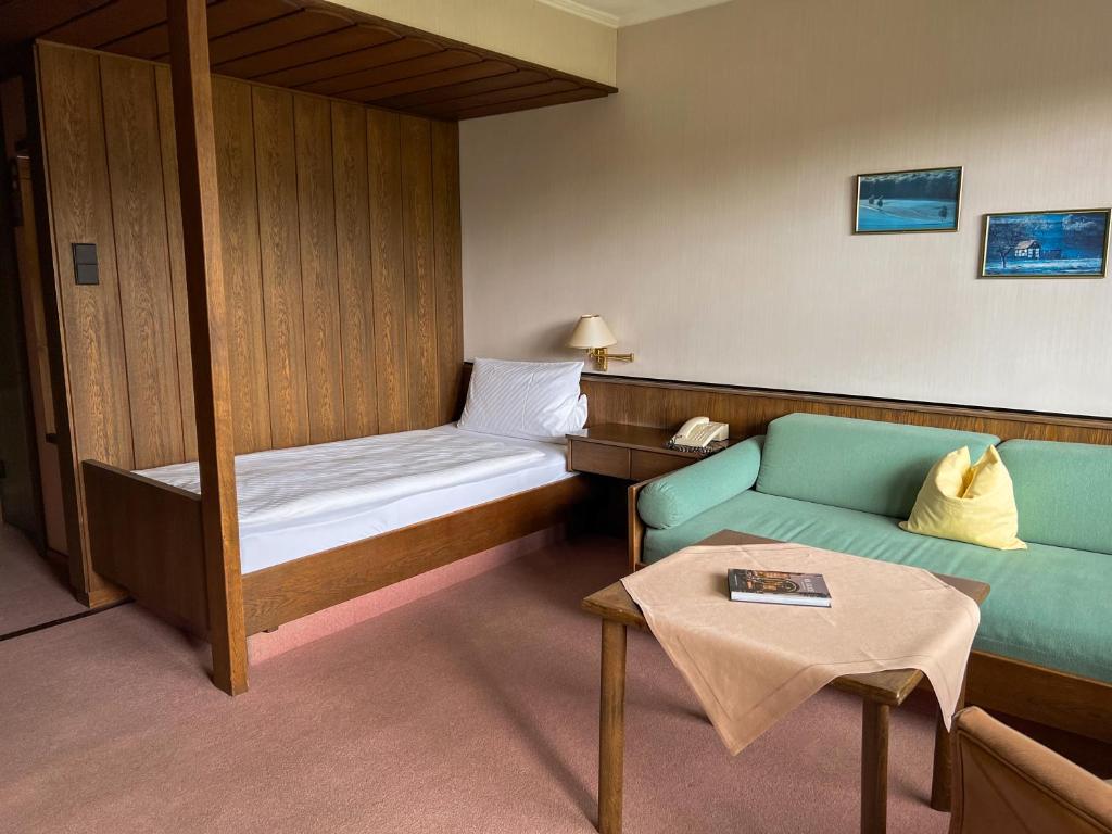 Postel nebo postele na pokoji v ubytování Romantik Hotel Störmann