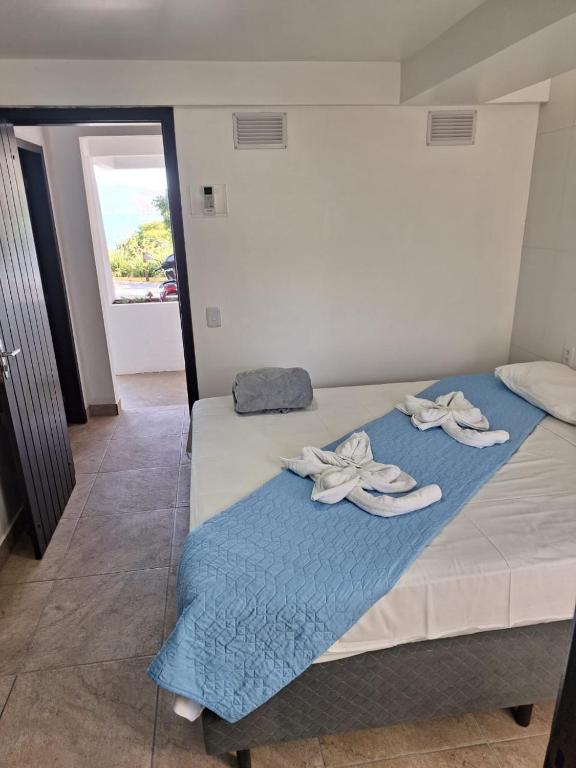 Cama ou camas em um quarto em Pousada Caminho do Mar