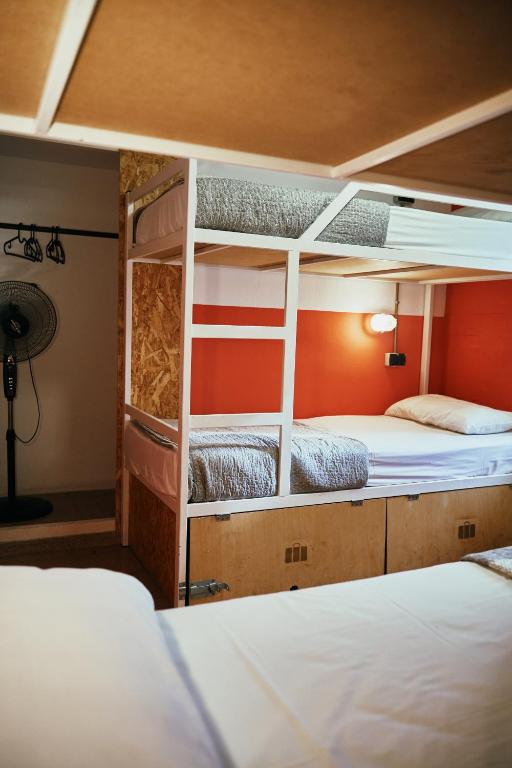 A bed or beds in a room at LOFT HOSTAL Group