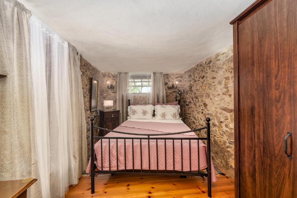 Postel nebo postele na pokoji v ubytování Malsova Maisonette