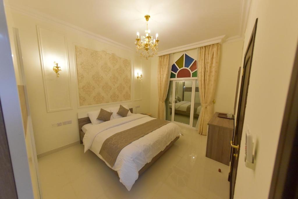 Postel nebo postele na pokoji v ubytování A'Sinamar Hotel Apartment