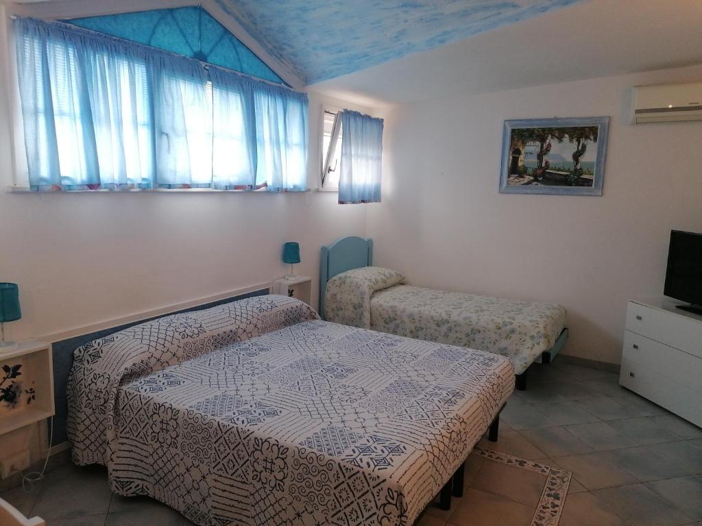 Postel nebo postele na pokoji v ubytování B&B Al Verde & Mare