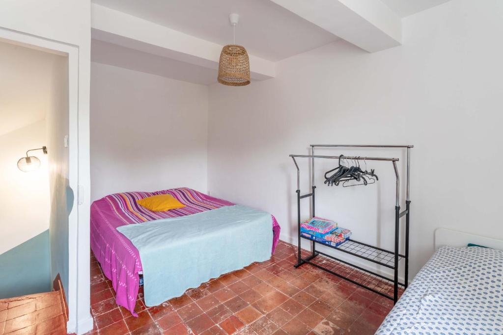 Postel nebo postele na pokoji v ubytování La maison d'à côté