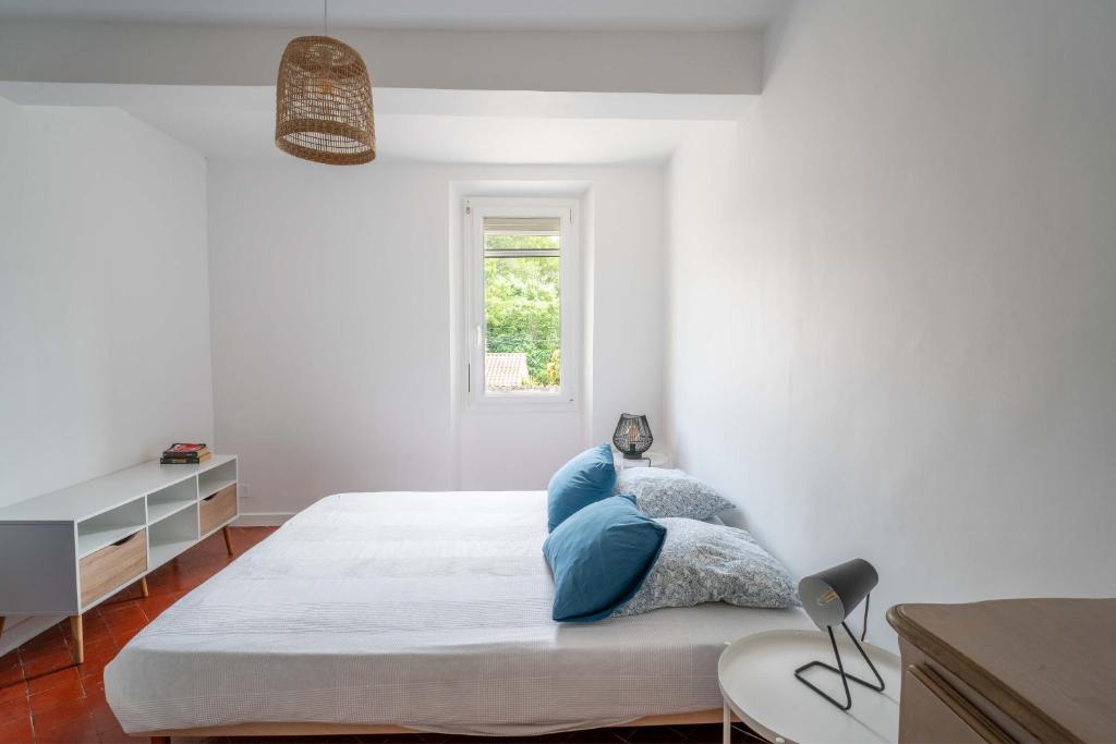 Postel nebo postele na pokoji v ubytování La maison d'à côté