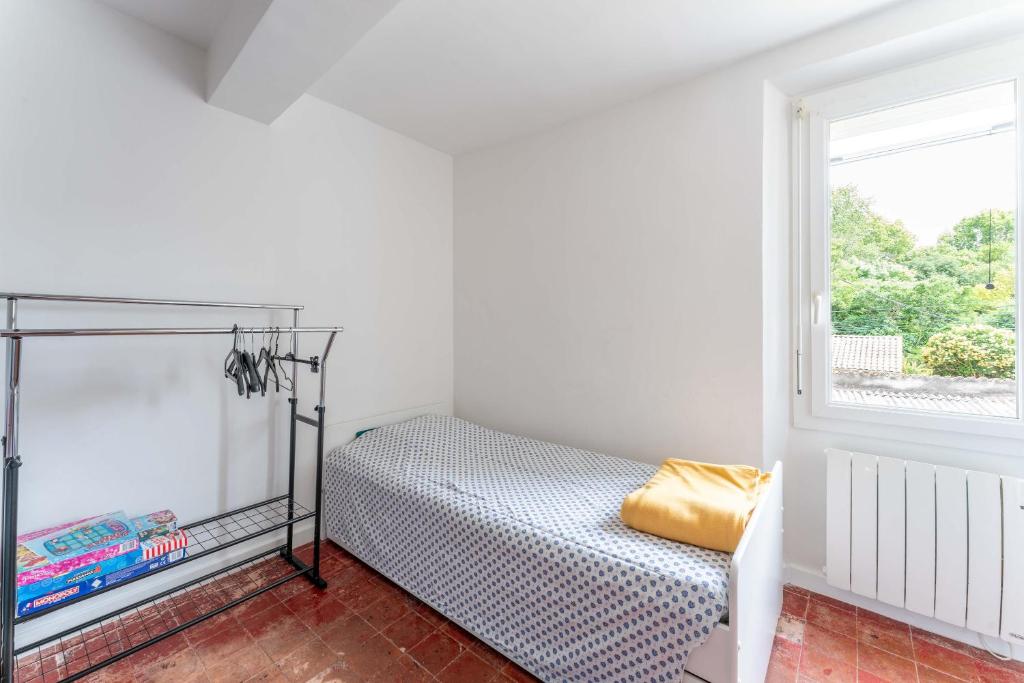 Postel nebo postele na pokoji v ubytování La maison d'à côté
