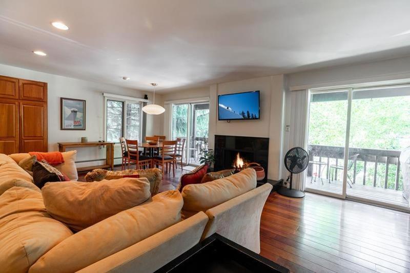 a large living room with a large couch at All Seasons Steps to Chairlift in Vail