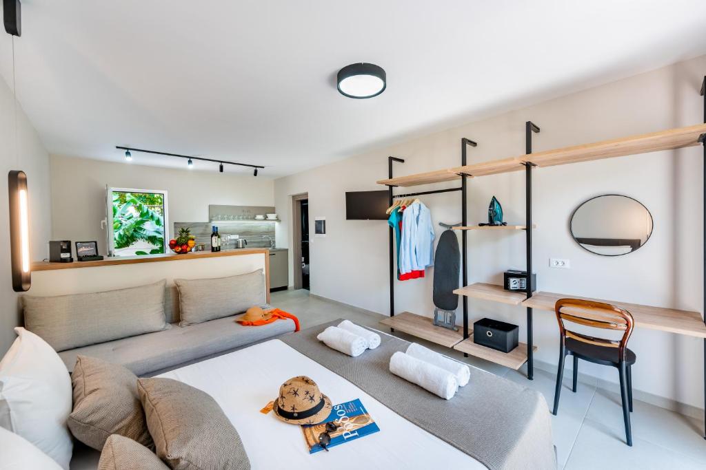 a living room with a couch and a table at Sokrates Studios in Afantou