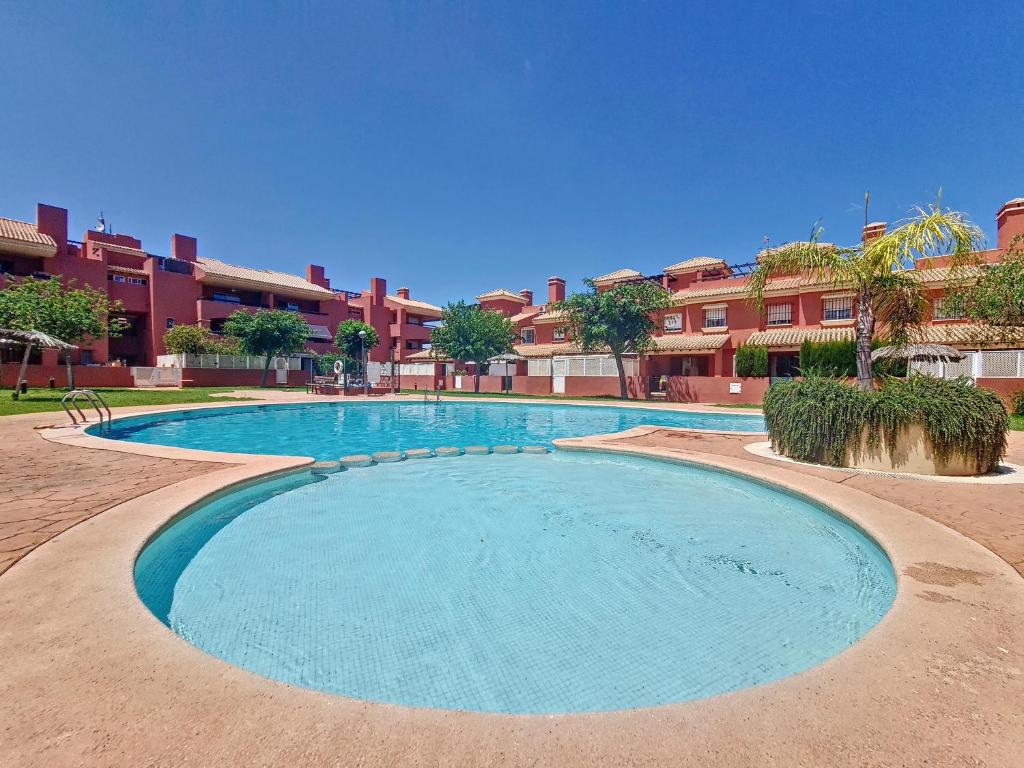 a large swimming pool in front of some buildings at Albatros Playa 1 - 9609 in Mar de Cristal