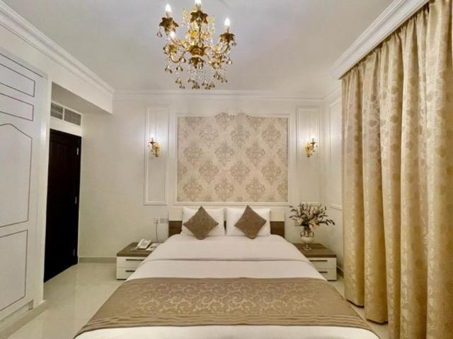 Postel nebo postele na pokoji v ubytování A'Sinamar Hotel Apartment