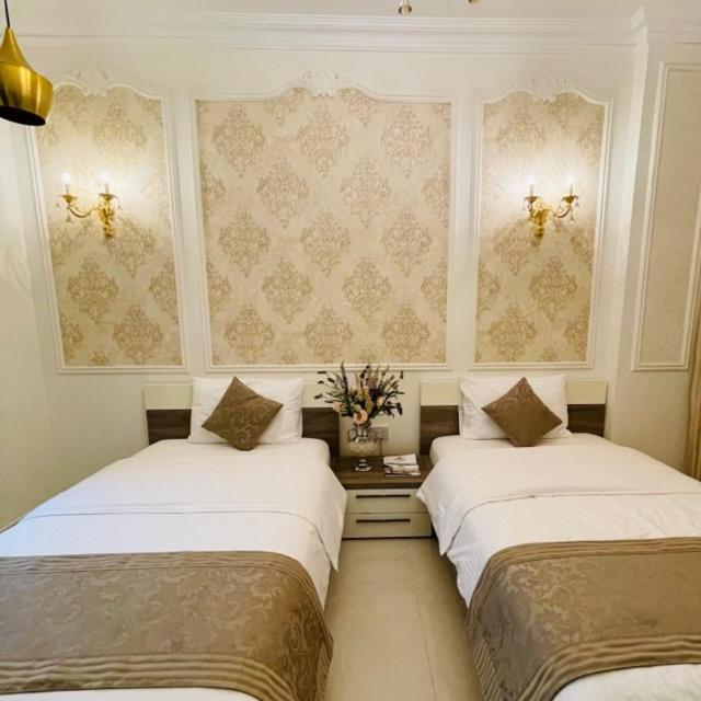 Postel nebo postele na pokoji v ubytování A'Sinamar Hotel Apartment