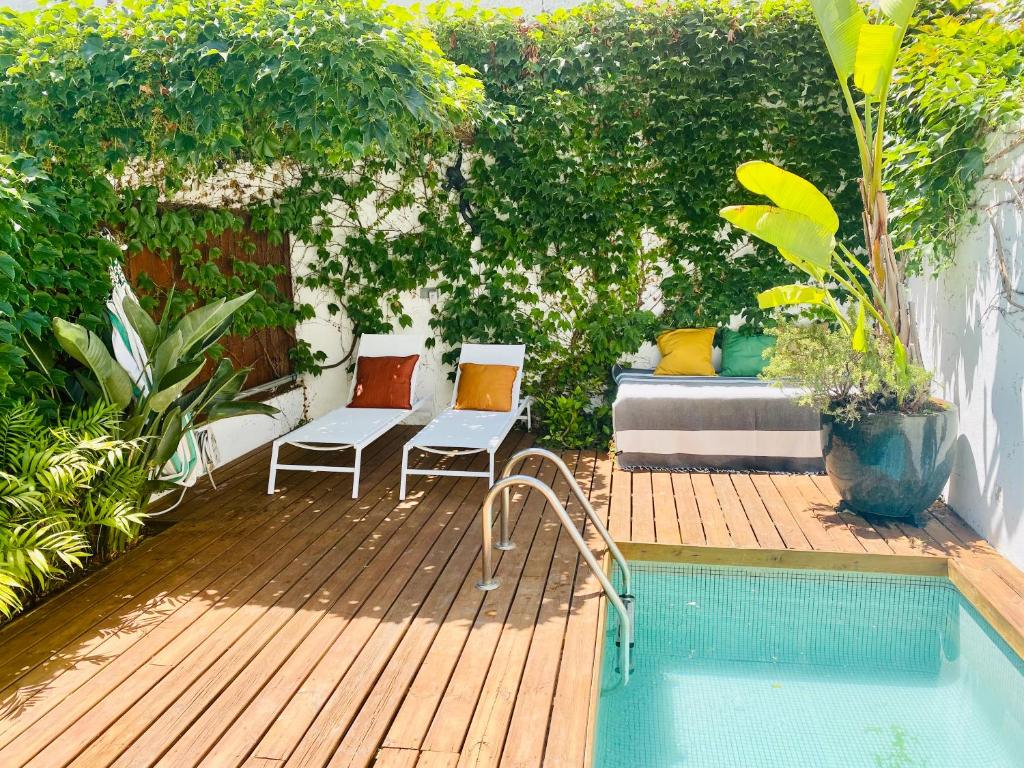 a patio with a bed and a swimming pool at Swimming pool Apartment Central Lisbon in Lisbon