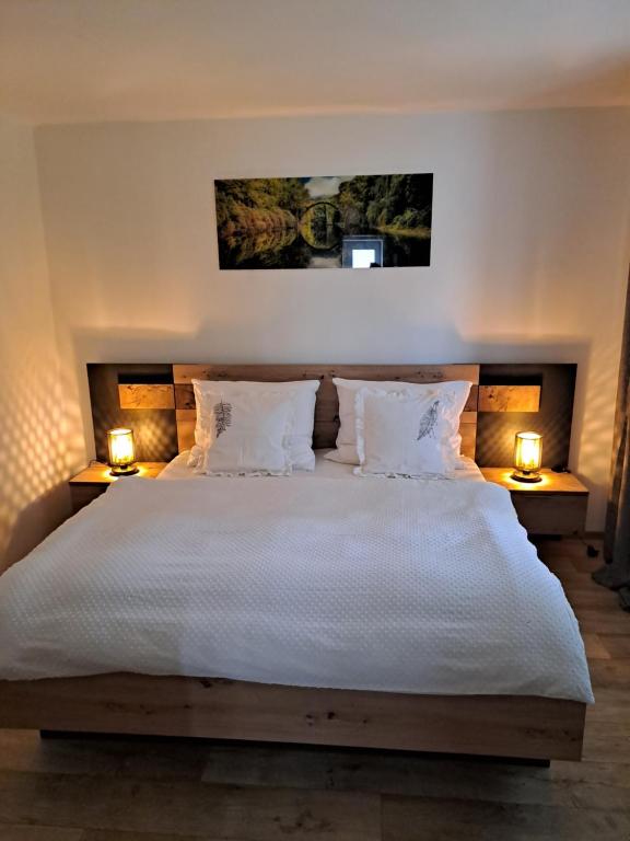 Postel nebo postele na pokoji v ubytování APARTMÁN ZLATÝ DUB