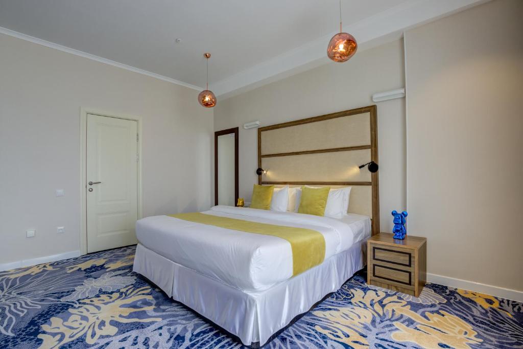Postel nebo postele na pokoji v ubytování Garden Hotel & SPA