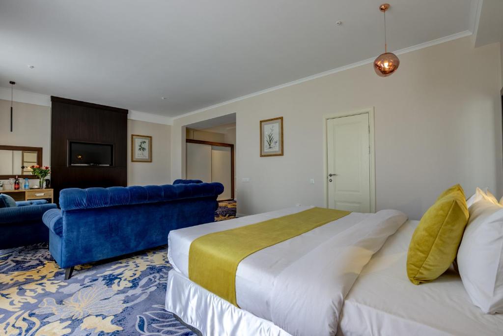 Postel nebo postele na pokoji v ubytování Garden Hotel & SPA