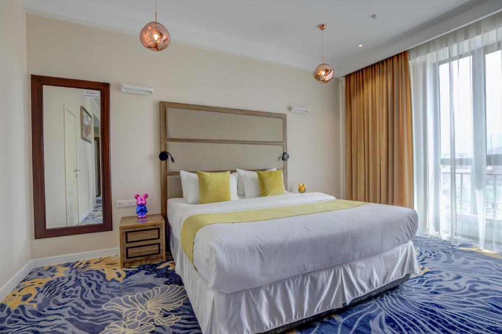 Postel nebo postele na pokoji v ubytování Garden Hotel & SPA