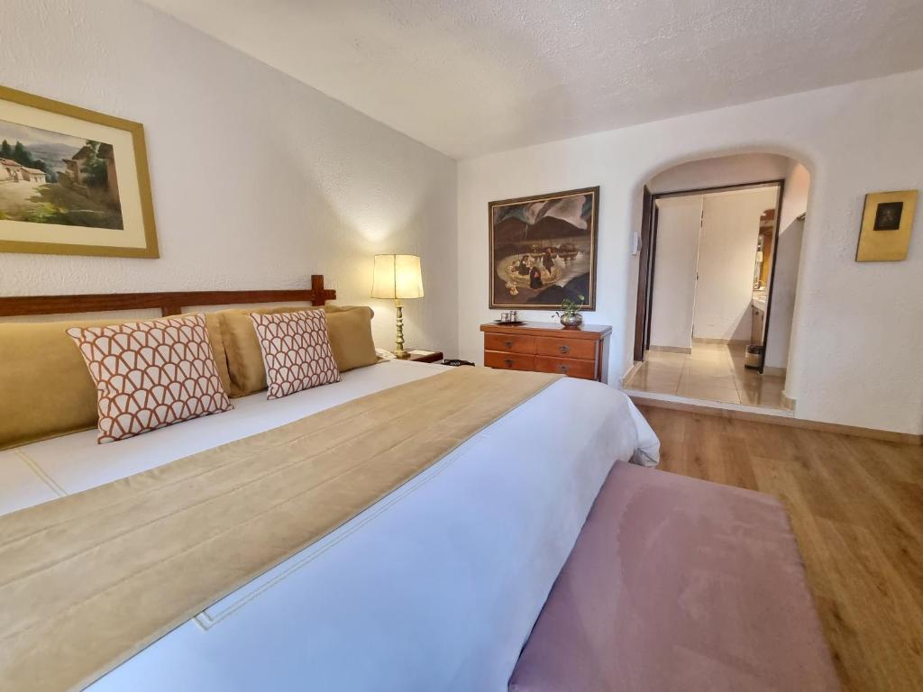 Postel nebo postele na pokoji v ubytování Antara Hotel & Suites - Miraflores