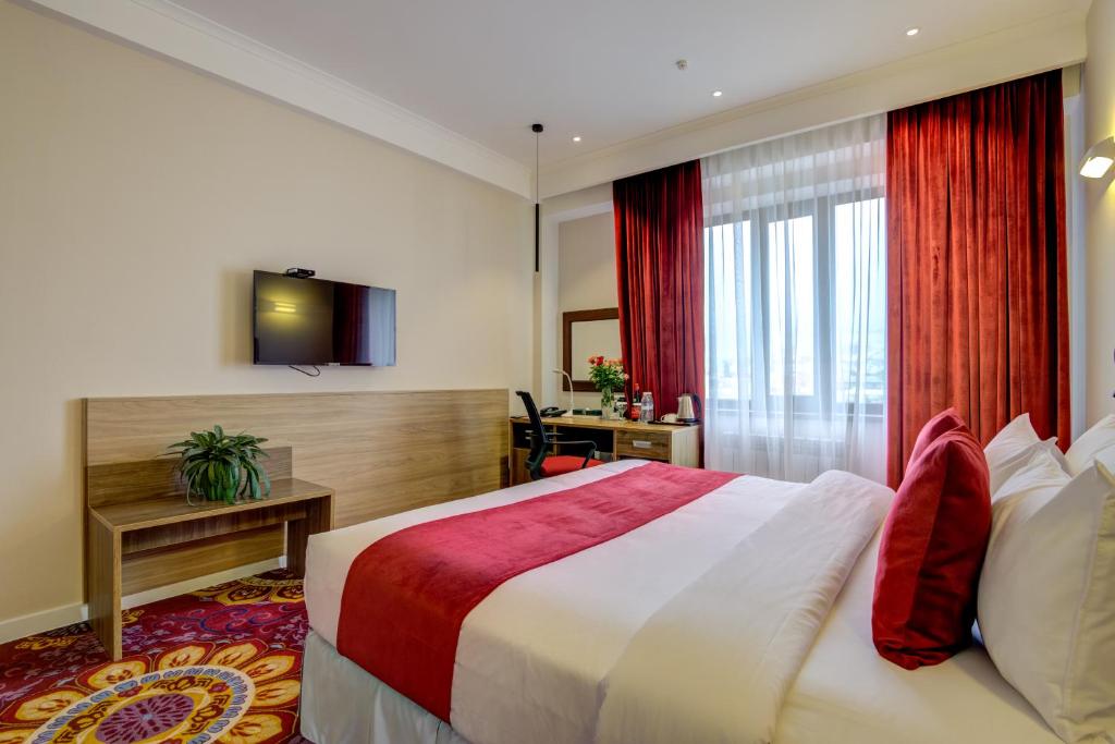 Postel nebo postele na pokoji v ubytování Garden Hotel & SPA