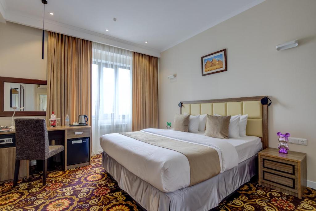 Postel nebo postele na pokoji v ubytování Garden Hotel & SPA