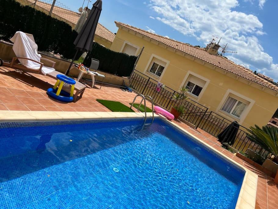 een zwembad voor een huis bij Casa playa in Segur de Calafell