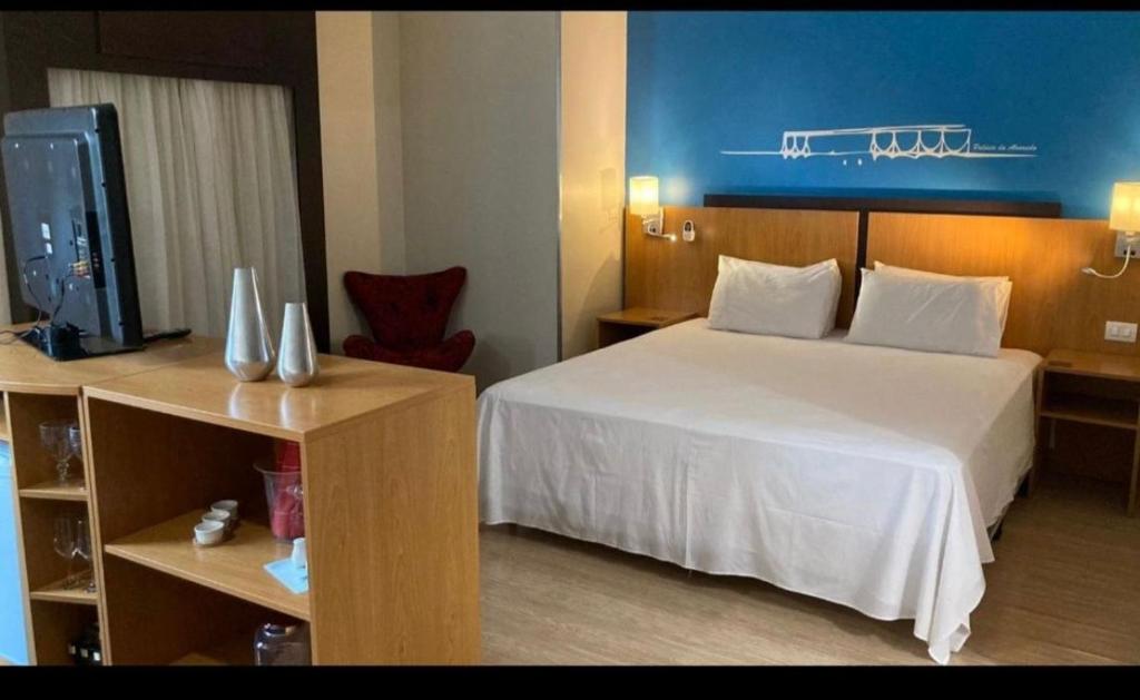 Ένα ή περισσότερα κρεβάτια σε δωμάτιο στο Apto no hotel Comfort de Taguatinga