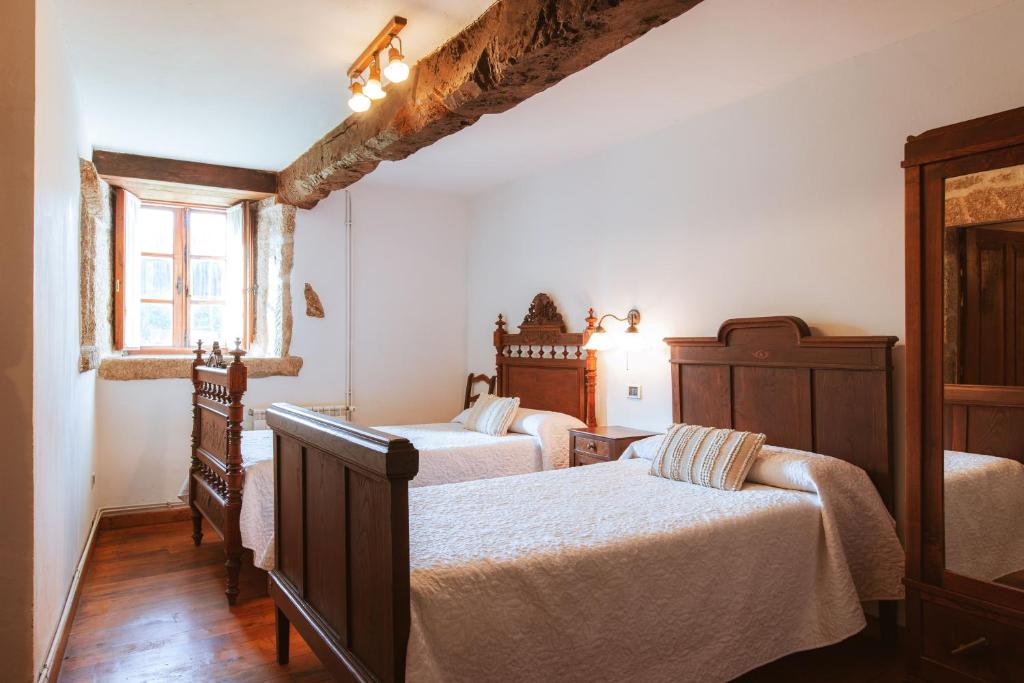 Postel nebo postele na pokoji v ubytování Casa Do Romualdo