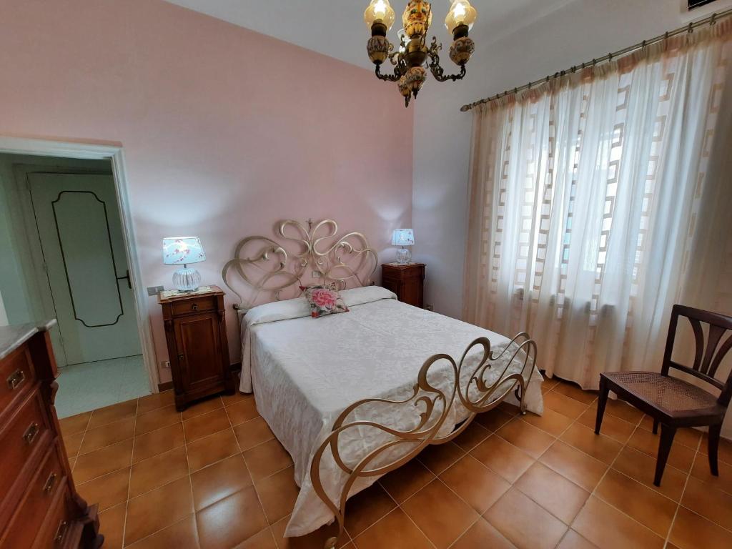 Postel nebo postele na pokoji v ubytování Casa Simonetta Il Glicine