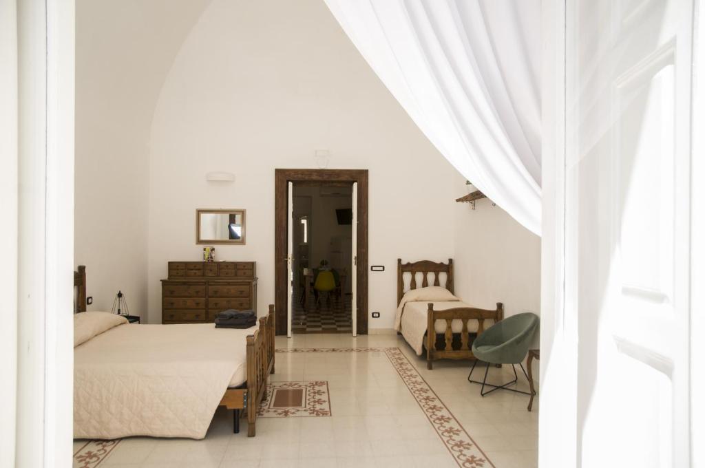 Ένα ή περισσότερα κρεβάτια σε δωμάτιο στο Palazzo Italia Apartments