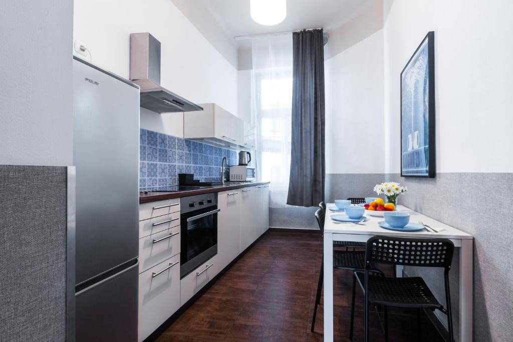 Kuchyňa alebo kuchynka v ubytovaní Friendhouse Apartments Starovislna
