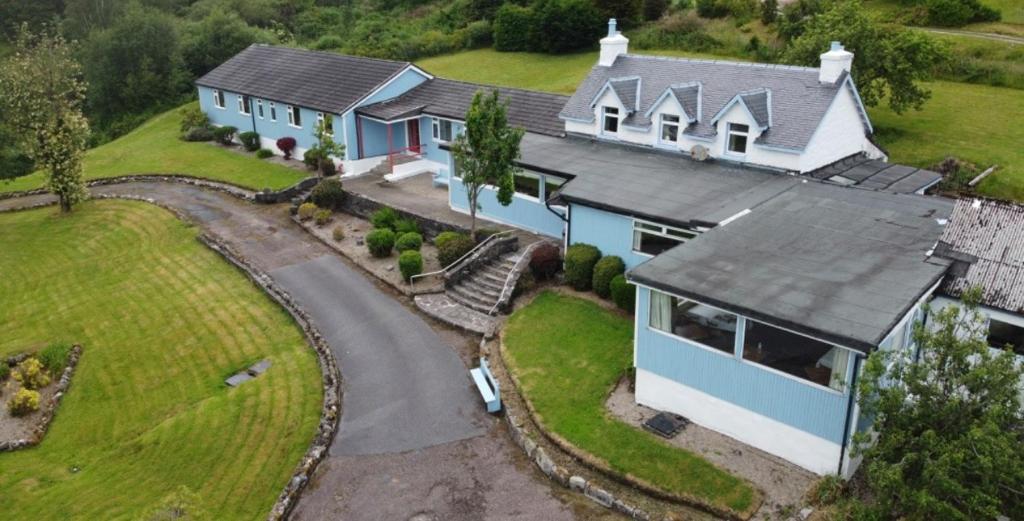 an aerial view of a house with a driveway at Ben View Phoenix Hotel in Strontian
