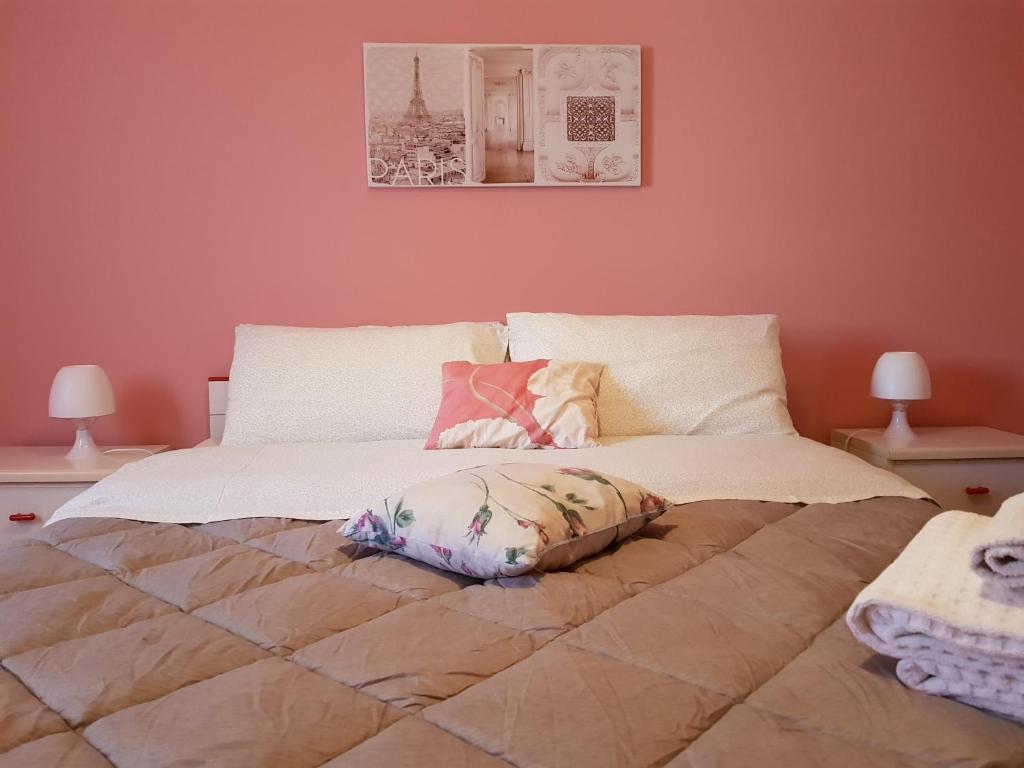 En eller flere senge i et værelse på La Maison di Arya