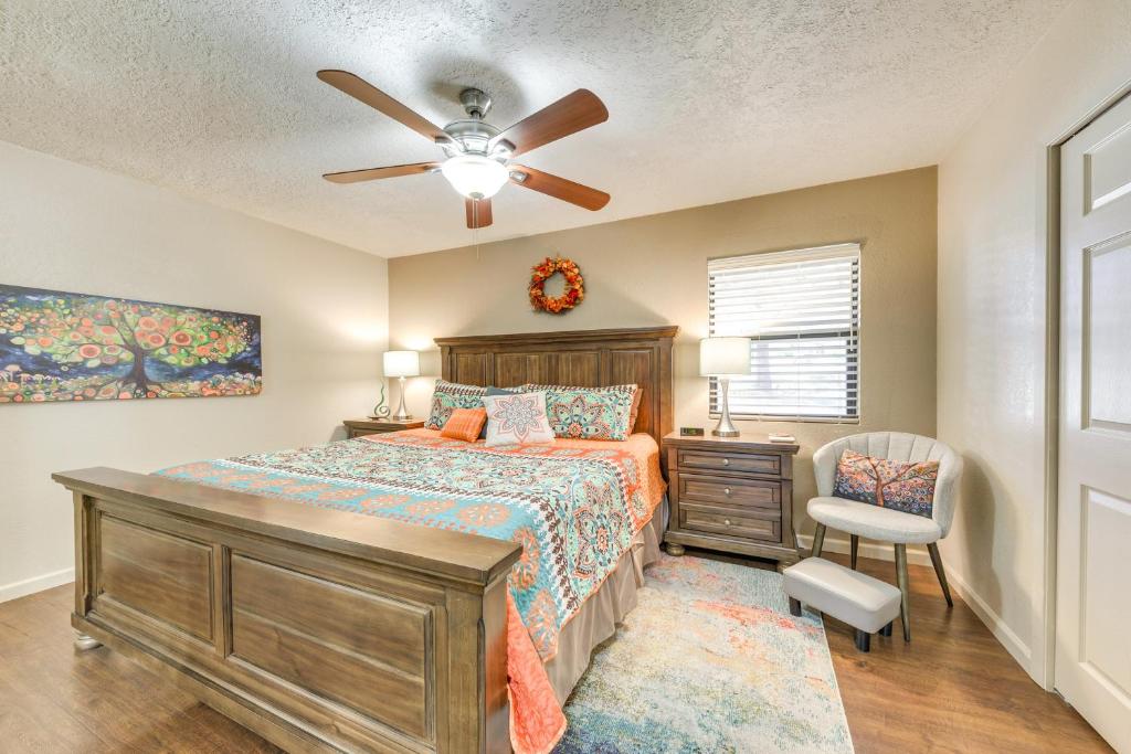 a bedroom with a bed and a ceiling fan at Ruidoso Golf Condo - Patio, Fire Pit and Mtn View! in Ruidoso