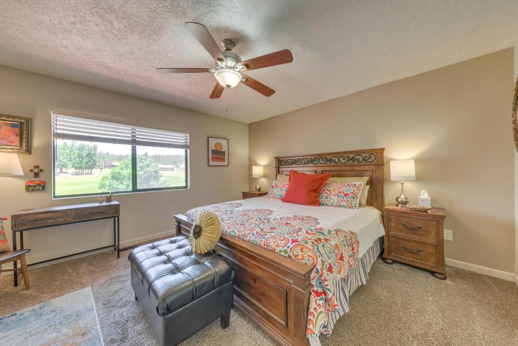 a bedroom with a bed and a ceiling fan at Ruidoso Golf Condo - Patio, Fire Pit and Mtn View! in Ruidoso