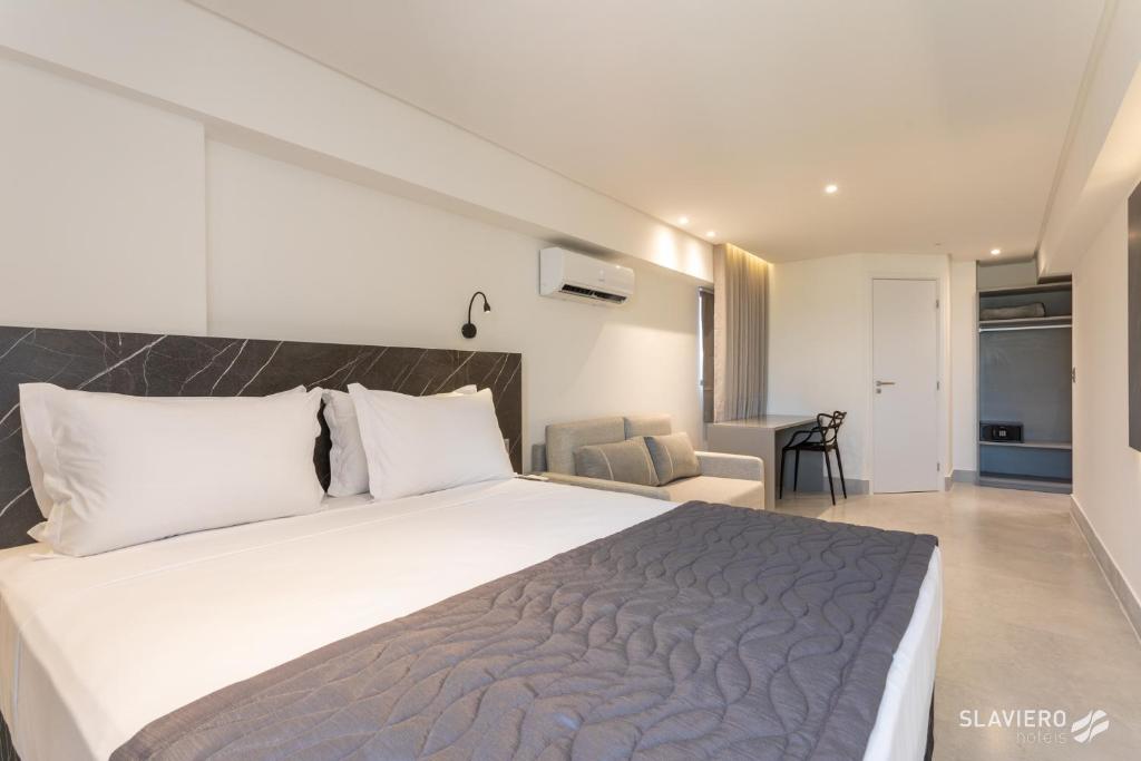 Cama ou camas em um quarto em Slaviero João Pessoa
