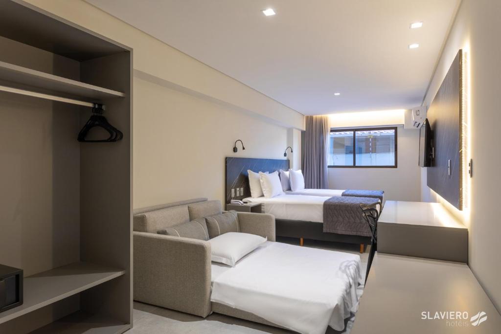 Cama ou camas em um quarto em Slaviero João Pessoa