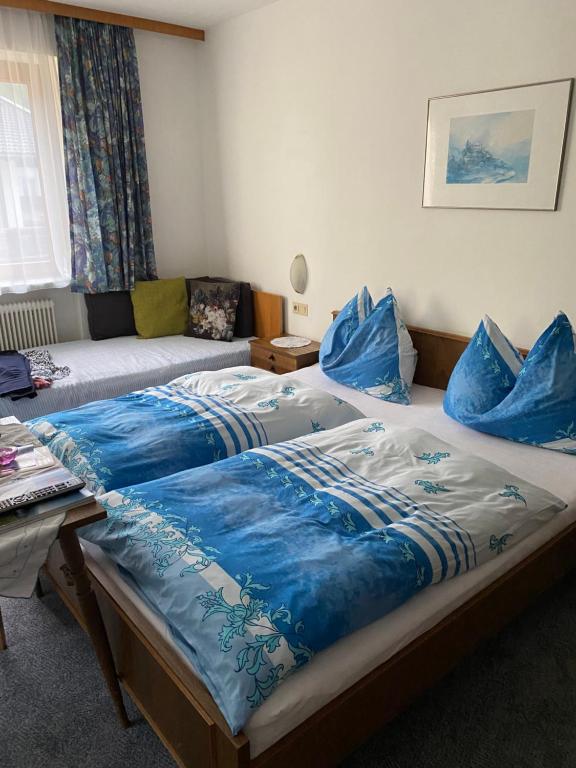 Postel nebo postele na pokoji v ubytování Gästehaus Hochwimmer