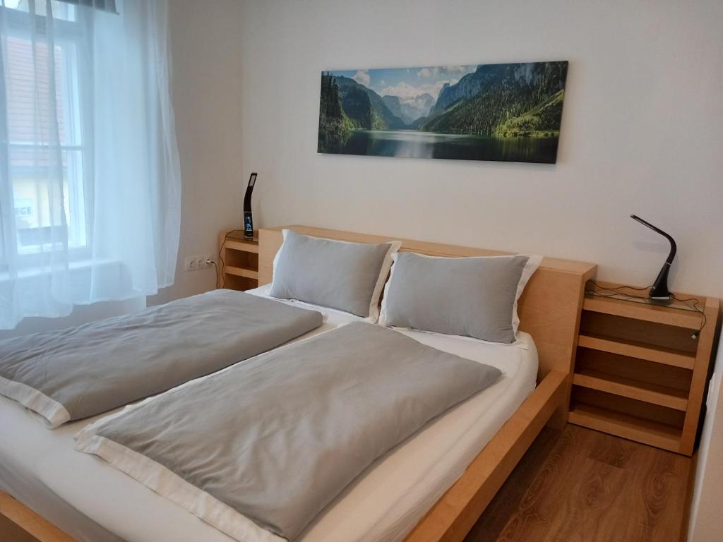 Postel nebo postele na pokoji v ubytování Korvin Plus Apartman