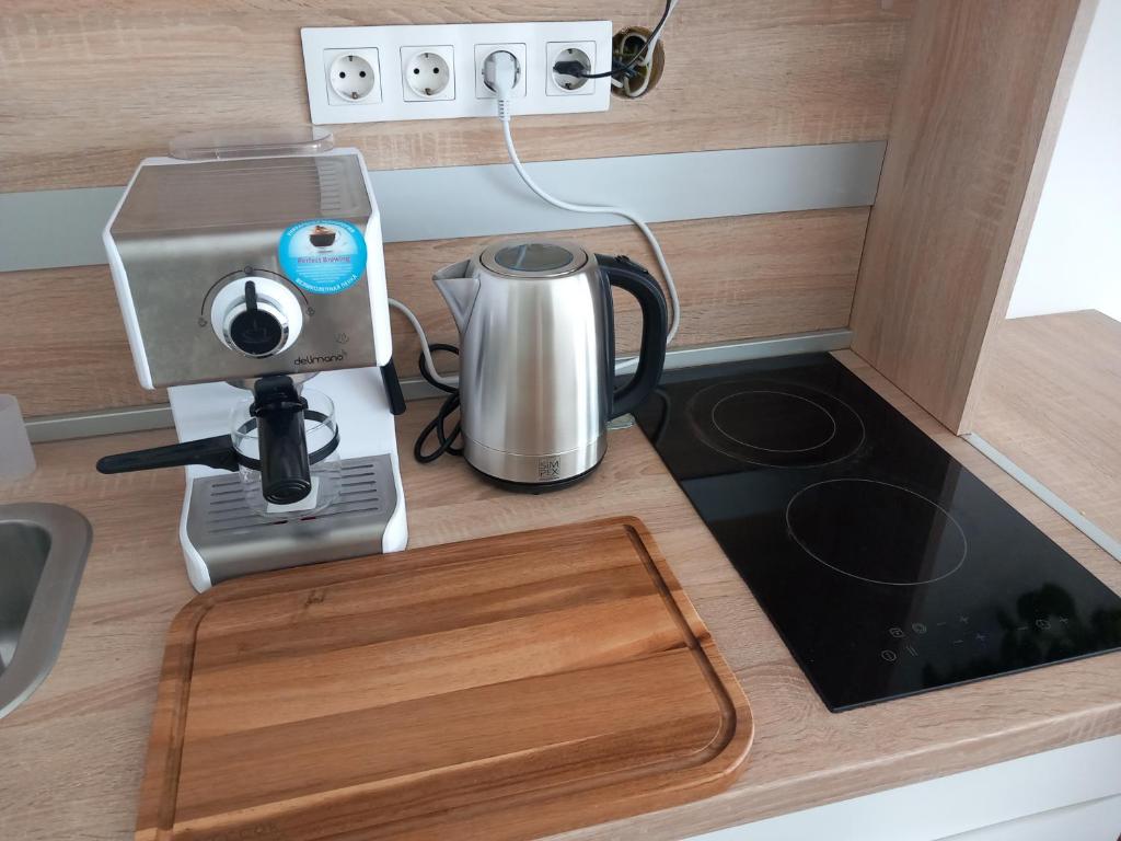 Kuchyň nebo kuchyňský kout v ubytování Korvin Plus Apartman