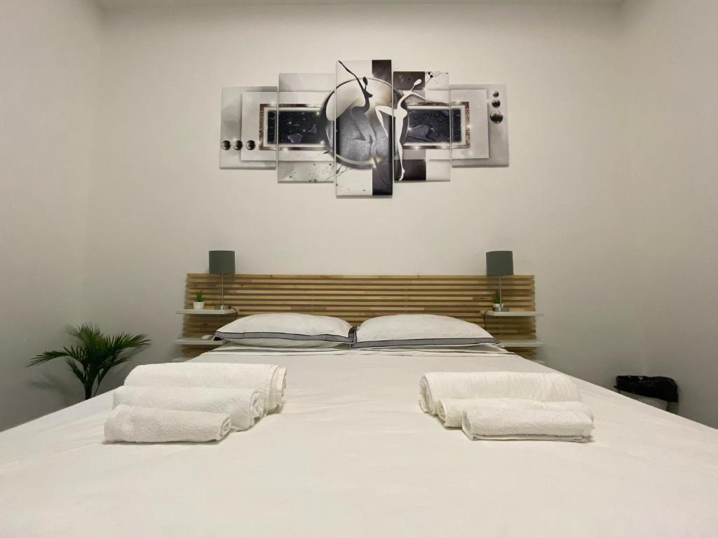 Säng eller sängar i ett rum på DM Rome Holiday