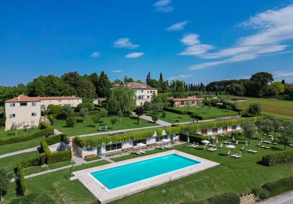 an aerial view of a large estate with a swimming pool at Resort Borgo Syrah in Cortona