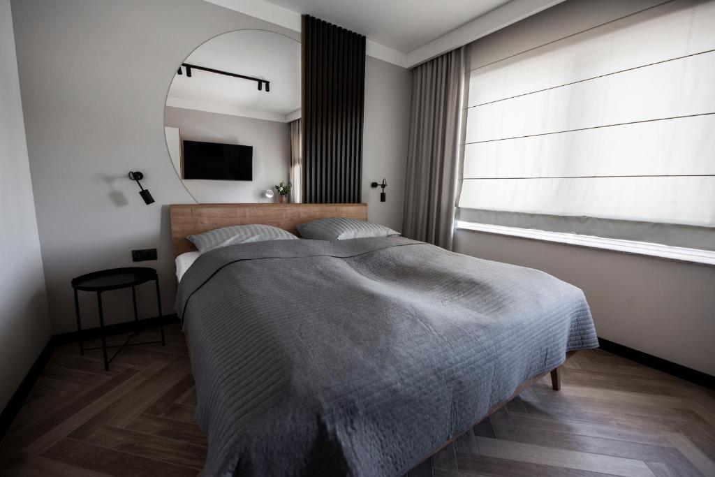 Postel nebo postele na pokoji v ubytování Lazur Apartamenty Domki