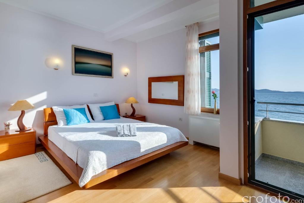 Posteľ alebo postele v izbe v ubytovaní Villa Niko