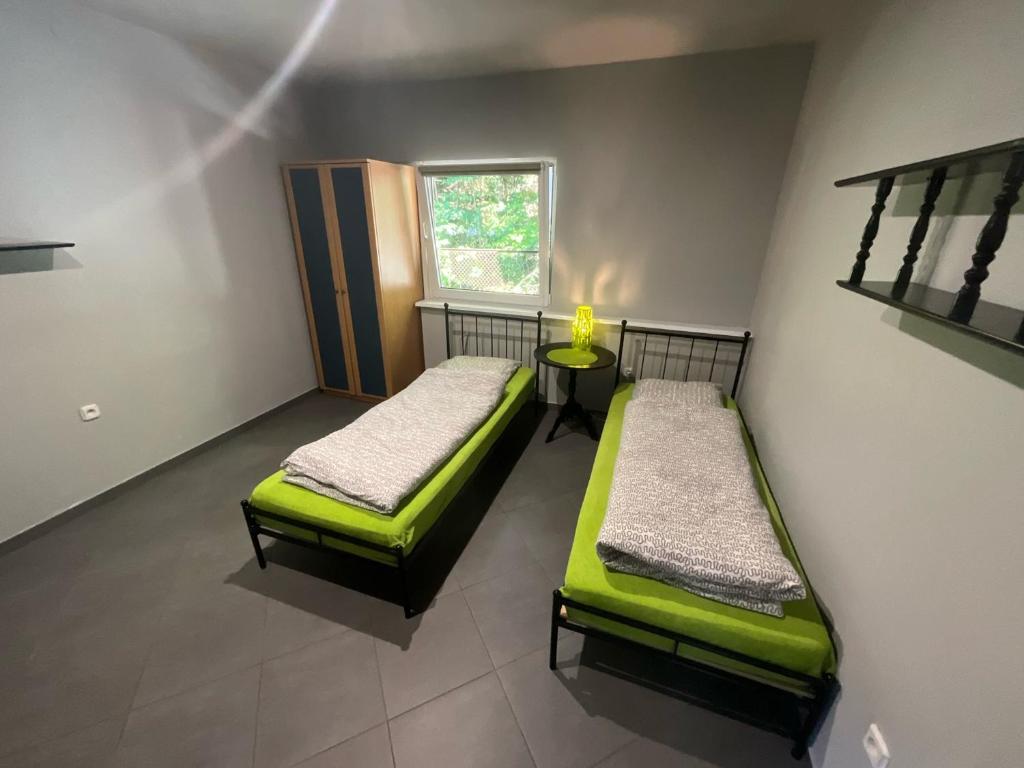 Postel nebo postele na pokoji v ubytování KEJA Pustkowo