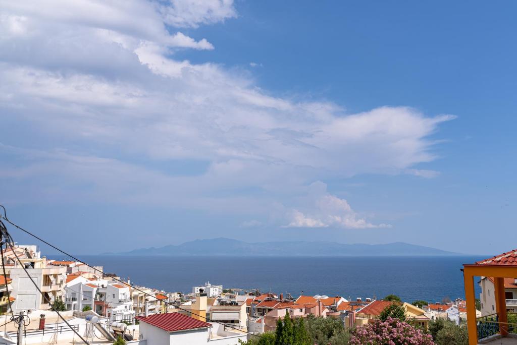 a view of a city with the ocean in the background at Stay in calm in Kavála