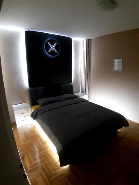 Postel nebo postele na pokoji v ubytování SPA apartments Kraljevo
