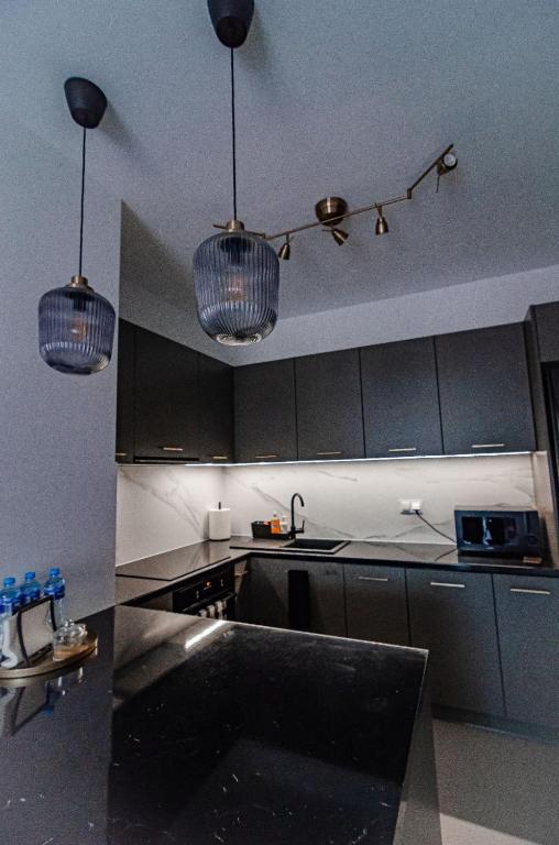 Kuchyň nebo kuchyňský kout v ubytování Apartament KARMEL
