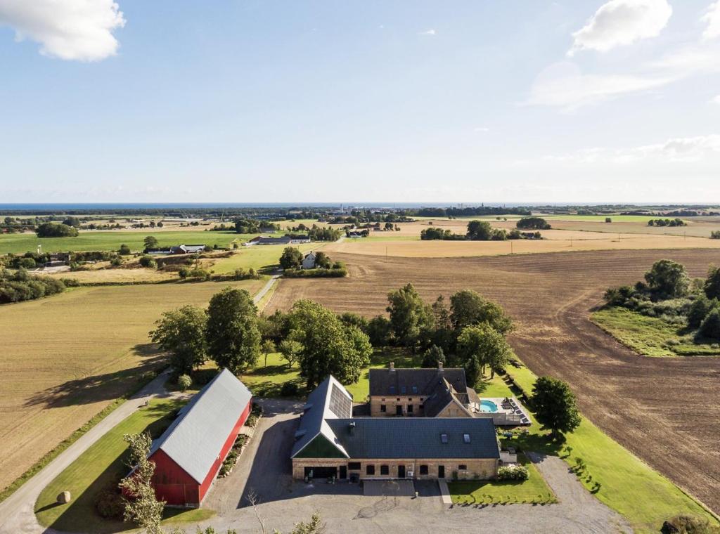 an aerial view of a house in a field at Ludvigsdal Semesterboende in Ystad