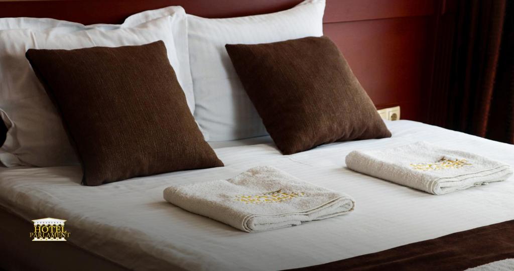 Postel nebo postele na pokoji v ubytování Hotel Parlament