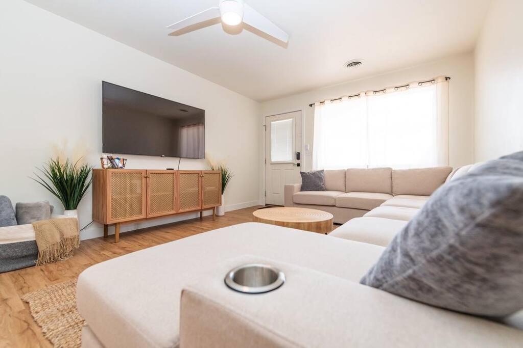 a living room with a couch and a flat screen tv at Newly Remodeled Family Friendly Home in Page