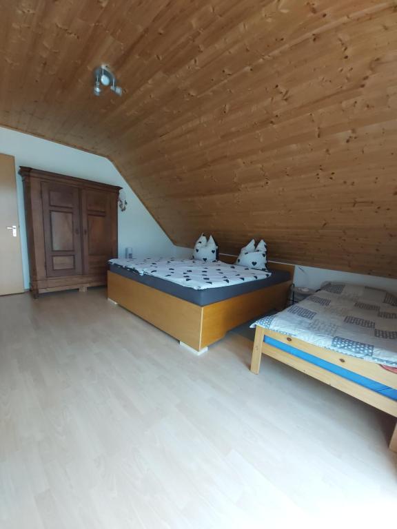 Postel nebo postele na pokoji v ubytování tAllhouse